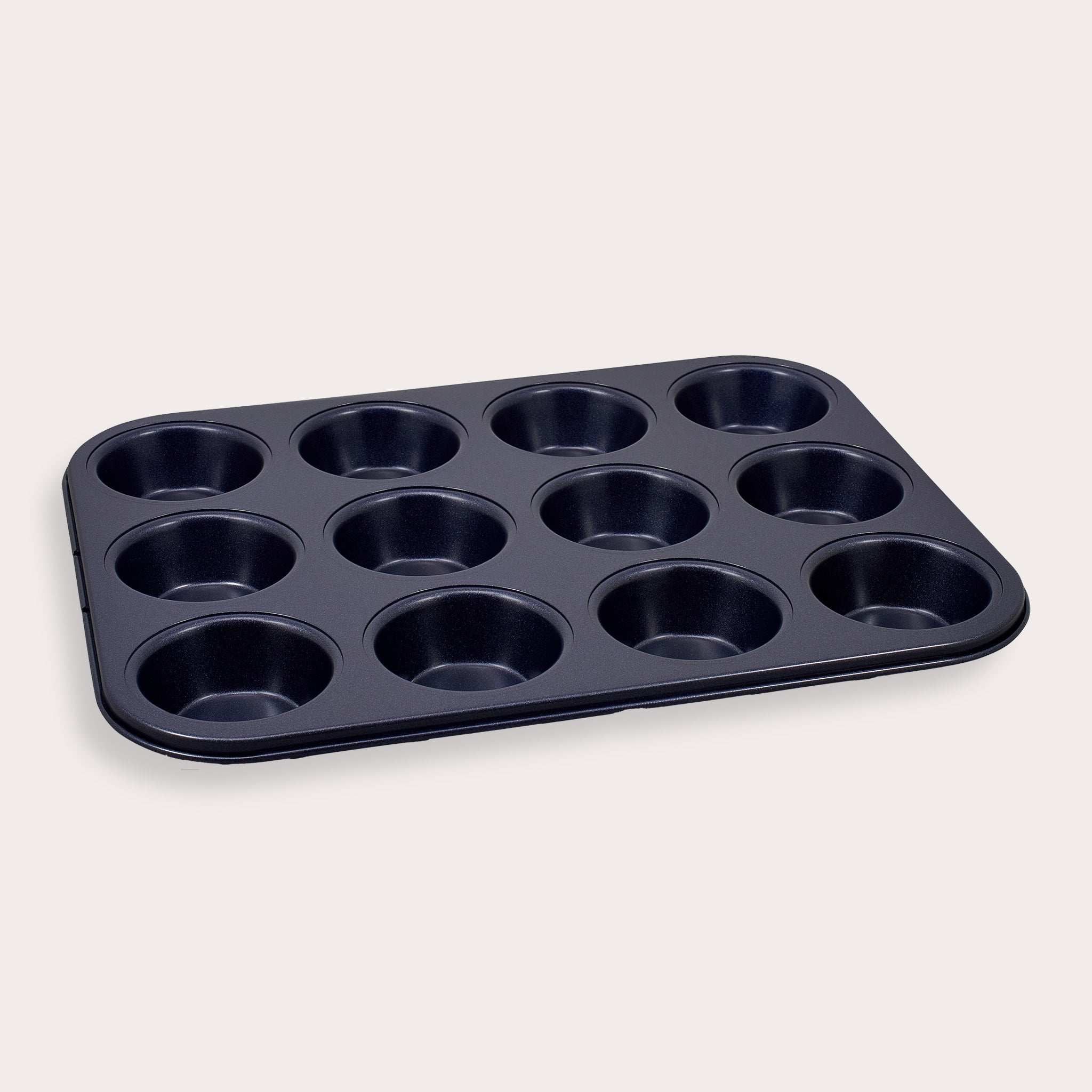 A non-stick, 12-cup muffin or cupcake baking tray is shown against a plain, light-colored background.