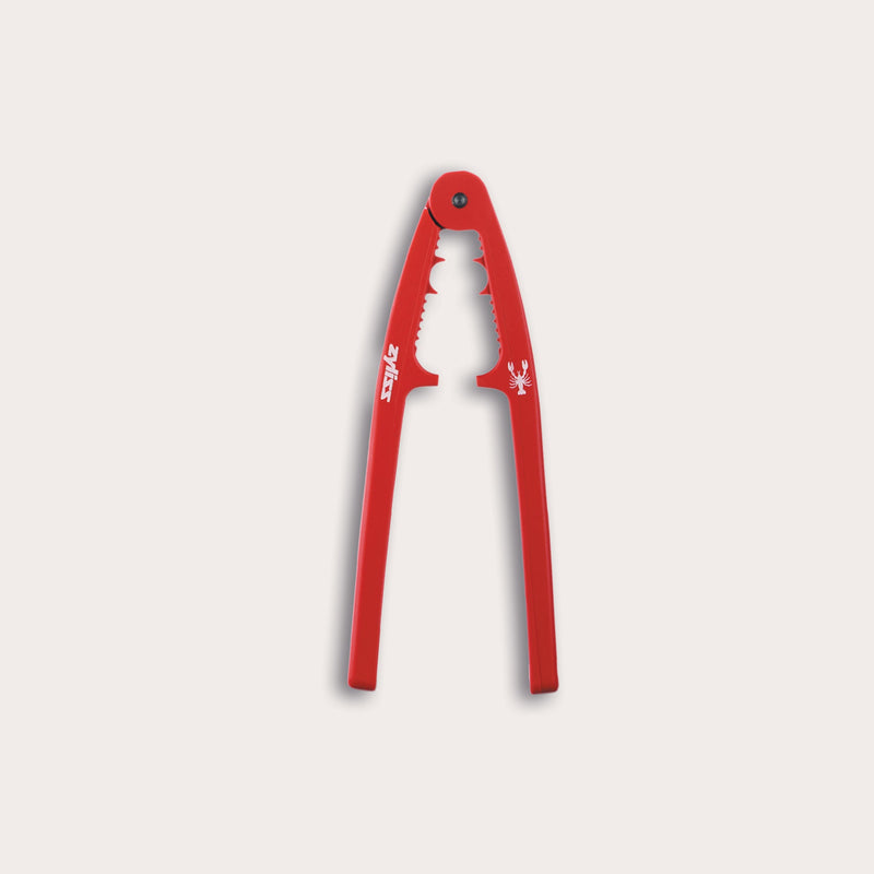 The Zyliss Seafood Cracker features ergonomic red handles, a sturdy metal hinge, and jagged edges for cracking nuts or shellfish. Shown open and facing upward against a plain white background.