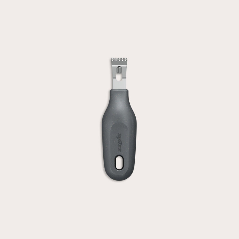 The Zyliss 2-In-1 Zester, made of stainless steel with a black ergonomic handle and a hole at the base, is an eco-friendly kitchen tool shown against a plain light background. 