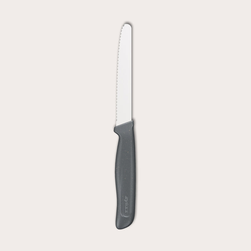 The Zyliss Tomato Knife Serrated 11cm / 4½ features a silver serrated blade and an eco-friendly handle, shown against a plain white background. 