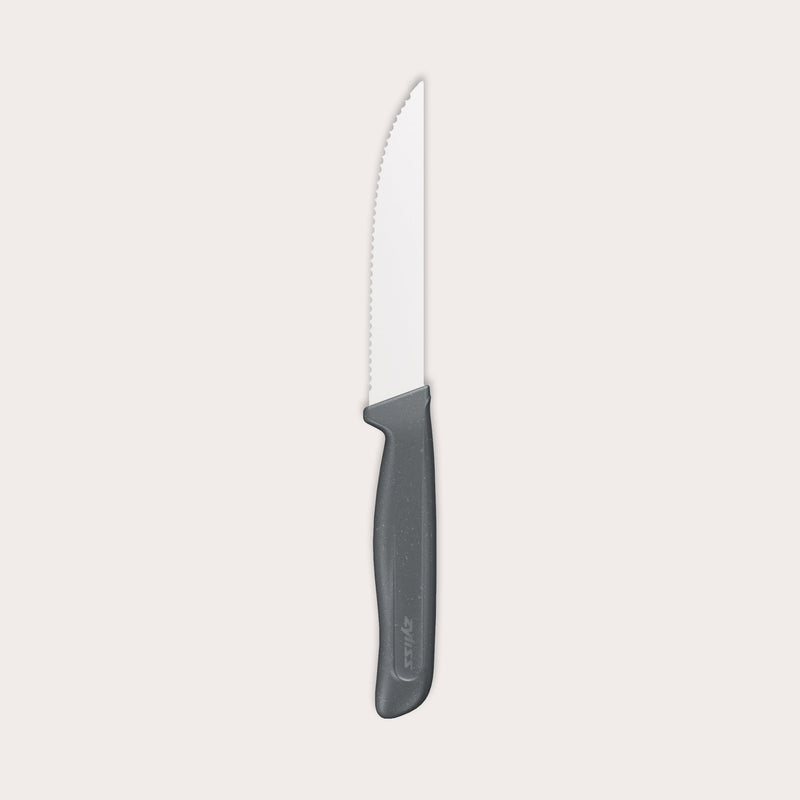 The Zyliss Steak Knife Serrated 11cm / 4½ features a silver blade and an ergonomic dark gray plastic handle, displayed against a plain light background. 