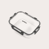 A rectangular clear Zyliss Glass Container for meal prep features a transparent lid with four black locking clips, Zyliss printed in black on the lid, all shown against a plain light background. #1.05L/1.1qt