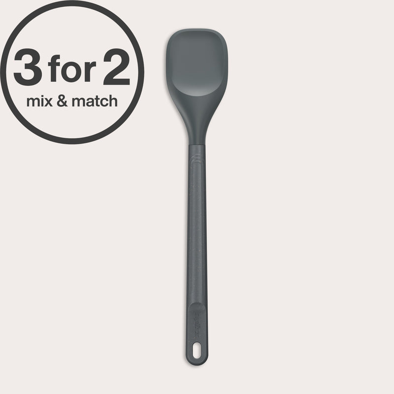 The Zyliss Spoontula, a grey heat-resistant silicone spoon with a long handle and durable head, rests on a light background. A circular label in the corner reads 3 for 2 mix & match.#Medium